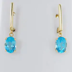 Pendientes oro amarillo 18k con topacios azules talla oval